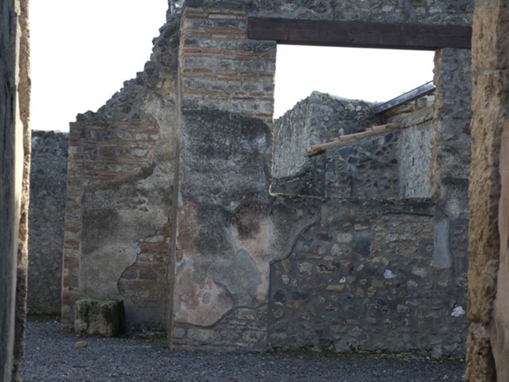 I.11.5 Pompeii. December 2007. Wall in south-west corner of atrium, with garden at rear.