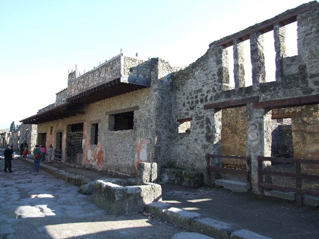 I.12.1 and I.12.2 Pompeii.  December 2006. Entrances on Via dellAbbondanza. Looking east.
