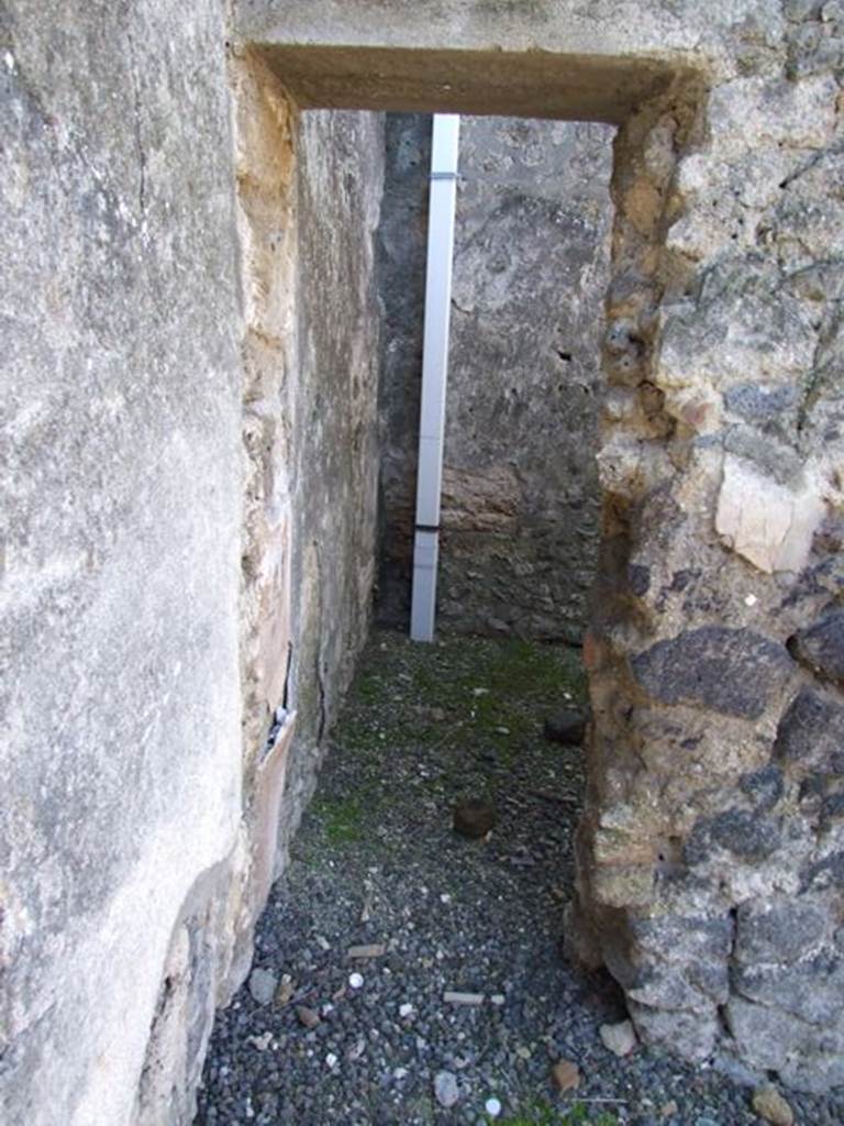 I.12.8 Pompeii.  March 2009. Doorway to room 4, on west side of entrance door.