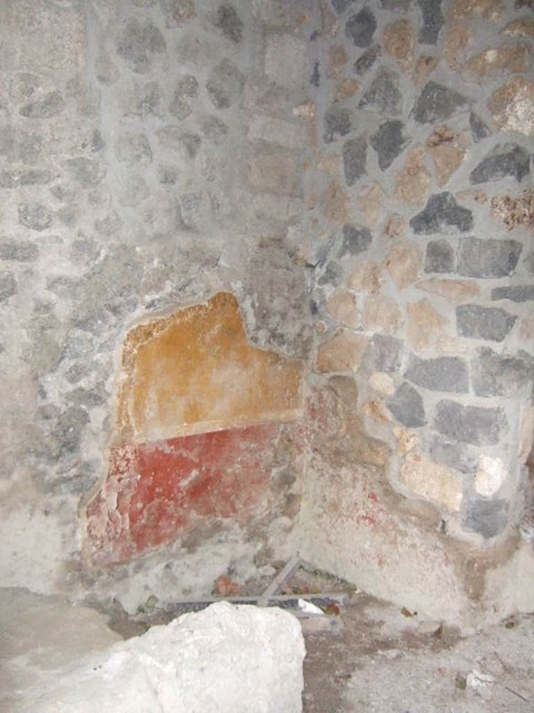I.13.9 Pompeii. May 2005. Painted plaster in south-east corner of atrium.