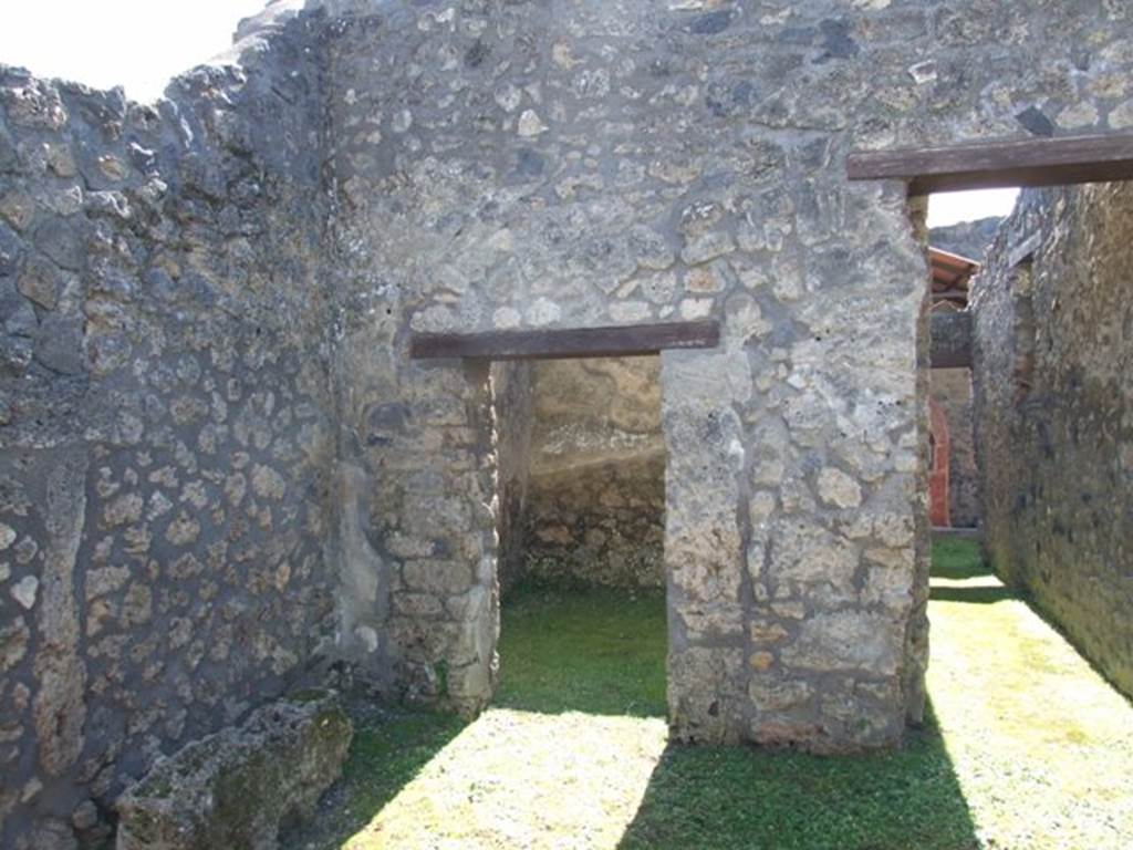 I.14.7 Pompeii.  March 2009.  South east corner of the atrium, with doorway to Cubiculum, and corridor to rear.