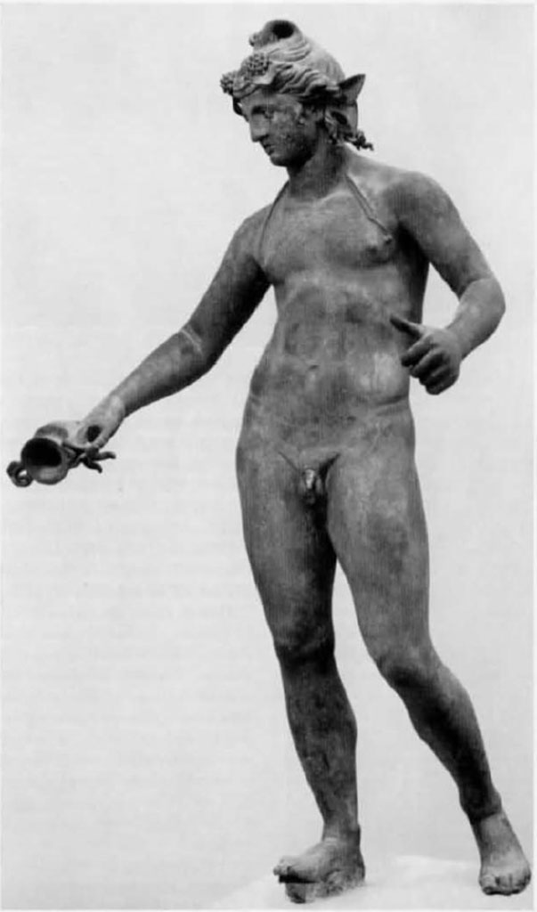 I.16.2, Pompeii. Bronze statue of a young Bacchus.
Found in a cubiculum adjacent to the fauces, on 26th September 1957. 
Then on display in Pompeii Antiquarium, see VIII.1.4. SAP inv. No. 11864.
It was found with many other bronze household goods/furnishings in a cubiculum of the atrium. 
See Elia, O., 1961. Bacco Fanciullo e Dioniso Chtonio a Pompei: Bollettino d’Arte 1961, Fasc I-II, (p.1.fig.1). 
See Rediscovering Pompeii, IBM catalogue, 1990-92, no.187, p.266-7.
