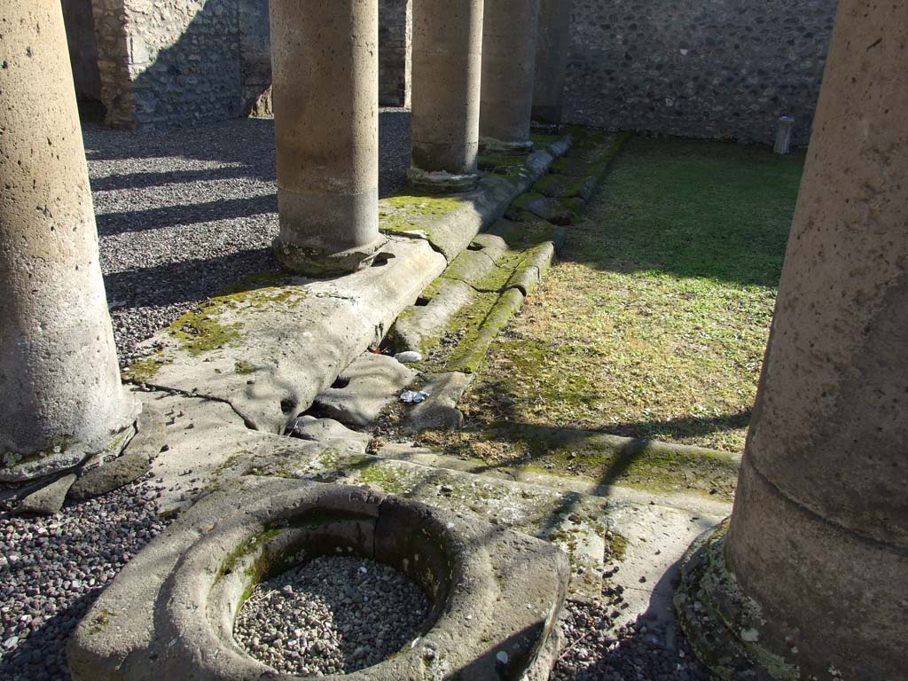 I.16.2 Pompeii. December 2006. East side of pseudoperistyle with cistern mouth and drainage channel, at north end.