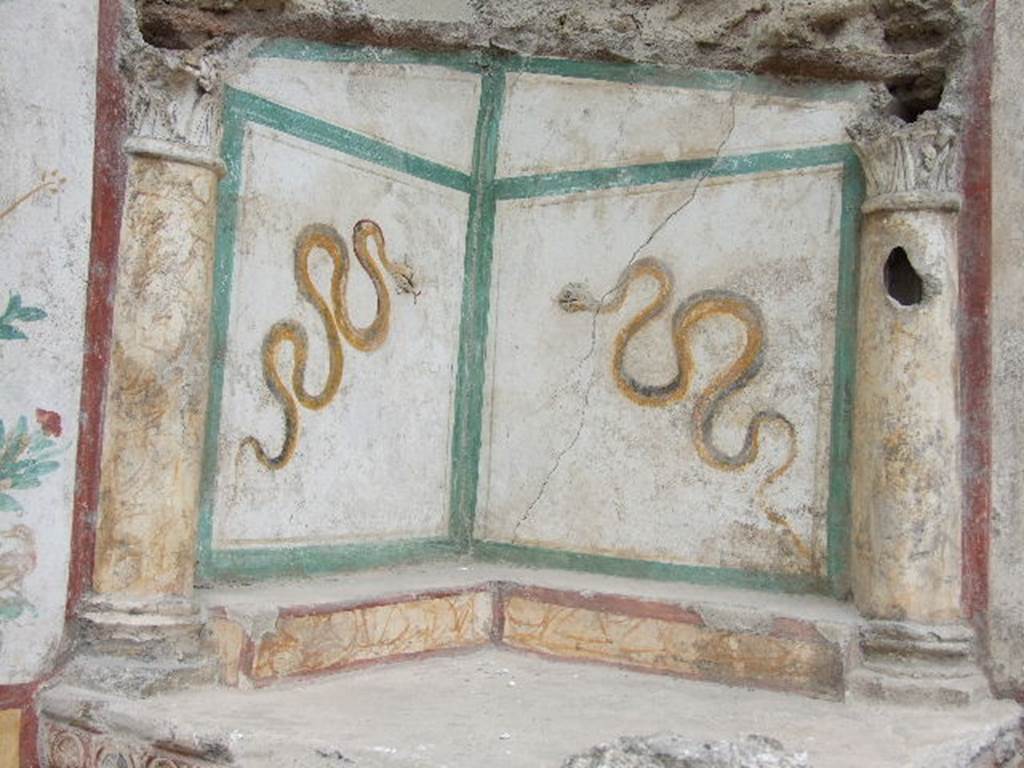 I.16.4 Pompeii. December 2006. Upper part of lararium, with details of two serpents.