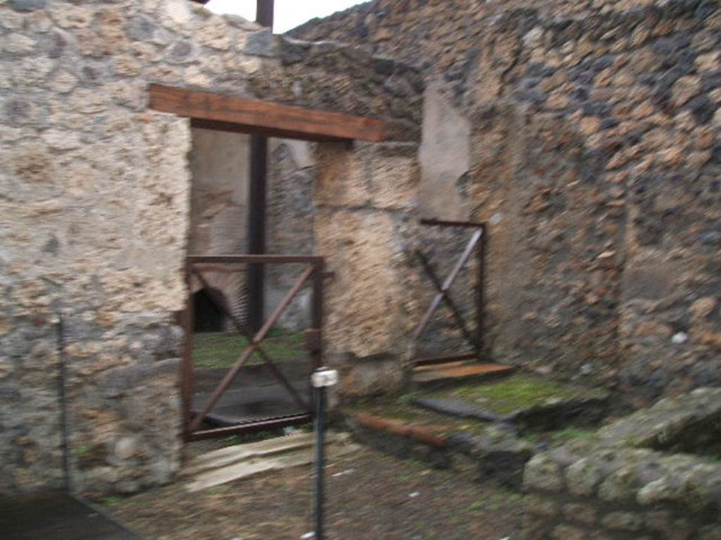 I.20.2 Pompeii. December 2004. Looking north-west towards doorway to I.20.3 from I.20.2.

