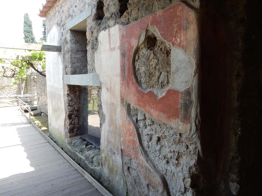 II.4.10 Pompeii. June 2019.  
Looking east towards exterior façade with window into biclinium, from near steps leading down into atrium from portico. Photo courtesy of Buzz Ferebee.
