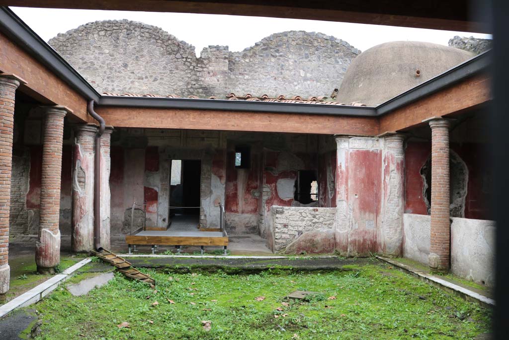 II.4.6 Pompeii. April 2019. Looking south across portico of baths, south-west corner, and west side.
Photo courtesy of Rick Bauer.
