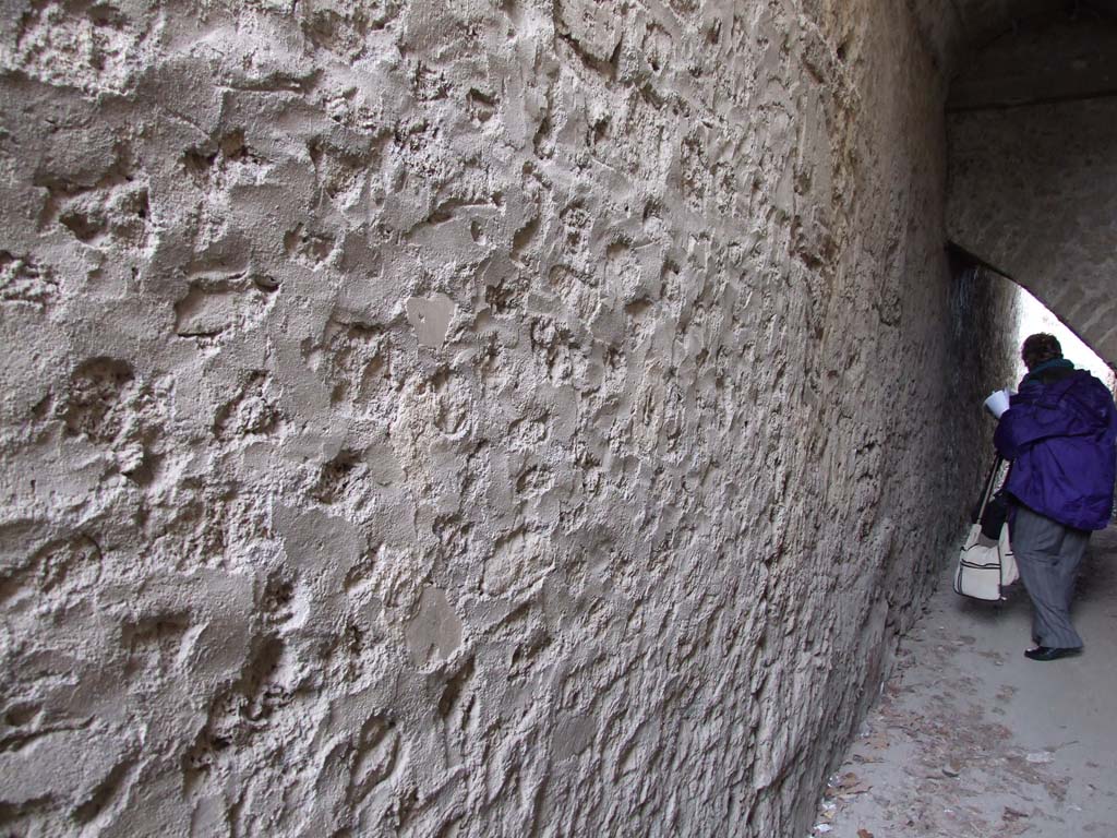 II.4.6 Pompeii. December 2006. Looking east.
Room to south of doorway at II.4.12, on west side of portico at north end, possibly with apartments to let above it.

