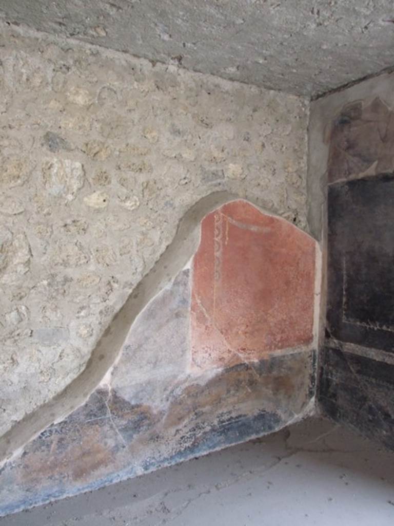 III.4.3  Pompeii.  March 2009. Room 3.  Triclinium.   Remains of painted panel on west wall in north west corner.  The  area in the centre was partially demolished by the 1943 bombing and the central panel, with the third of the famous moral sayings, was lost.  
Lascivos voltus et blandos aufer ocellos
Coniuge ab alterius : sit tibi in ore pudor.
See Della Corte, M., 1965.  Case ed Abitanti di Pompei. Napoli: Fausto Fiorentino. (p.361. CIL IV 7698a-c)