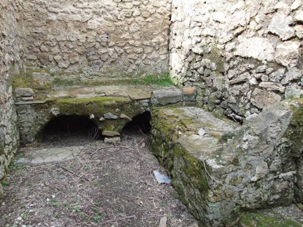 III.4.3  Pompeii.  March 2009. Room 6.  Kitchen and Latrine.  Hearth and bench.