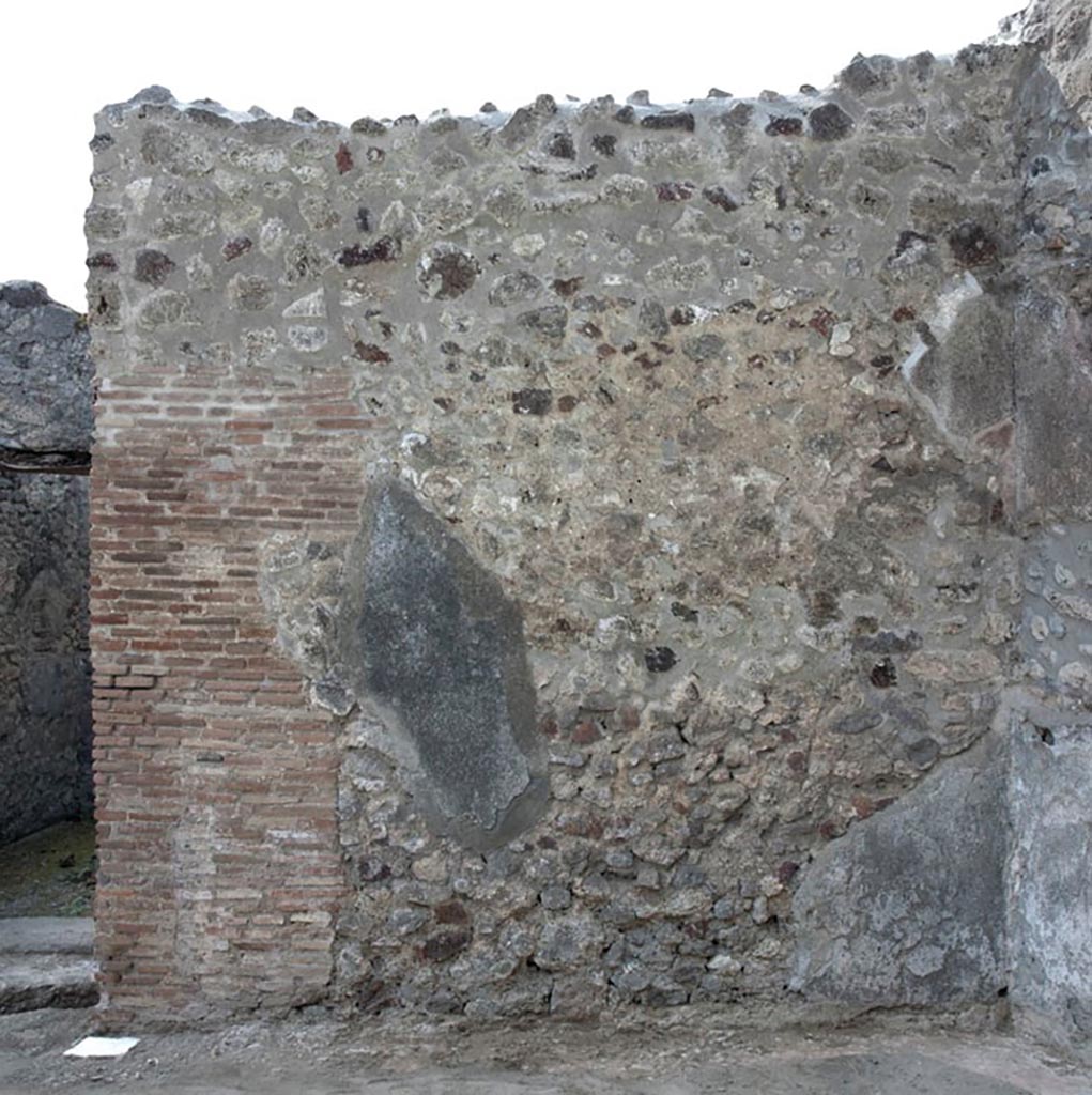 V.1.3 Pompeii. c.2012.
Room “a”, west wall of tablinum. Photo by Hans Thorwid.
“W wall in 2012. Restored parts of the wall photographed and merge with the lower part and floor line of earlier photos from 2005-7.”
Photo and words courtesy of the Swedish Pompeii Project. 
