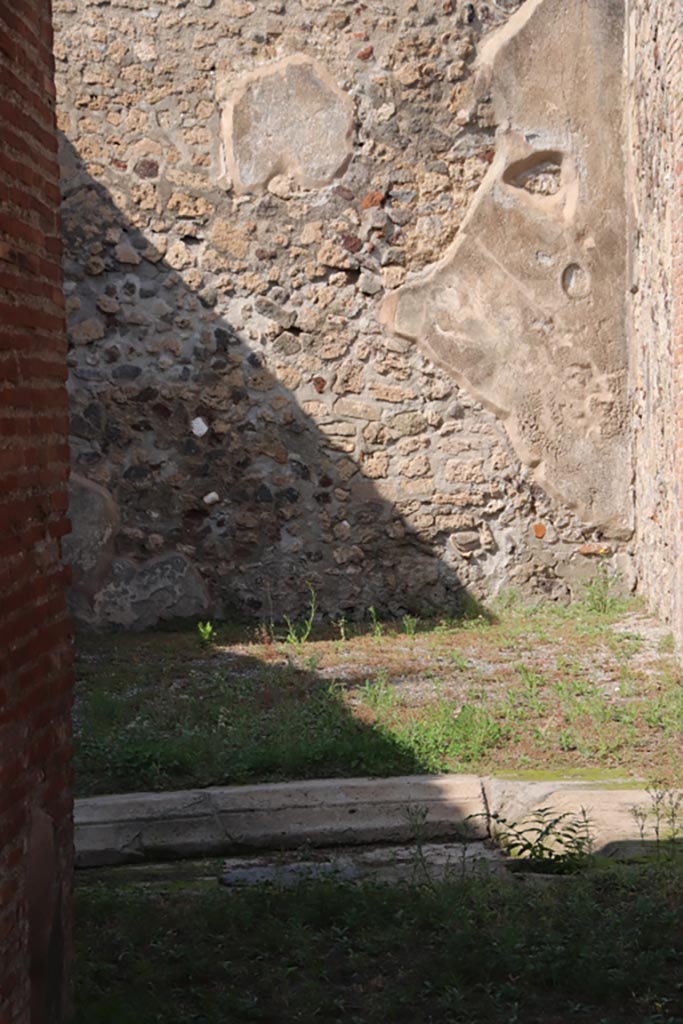 V.1.3 Pompeii. October 2023. 
Looking across impluvium in atrium, towards north wall and north-east corner of tablinum. 
Photo courtesy of Klaus Heese.


