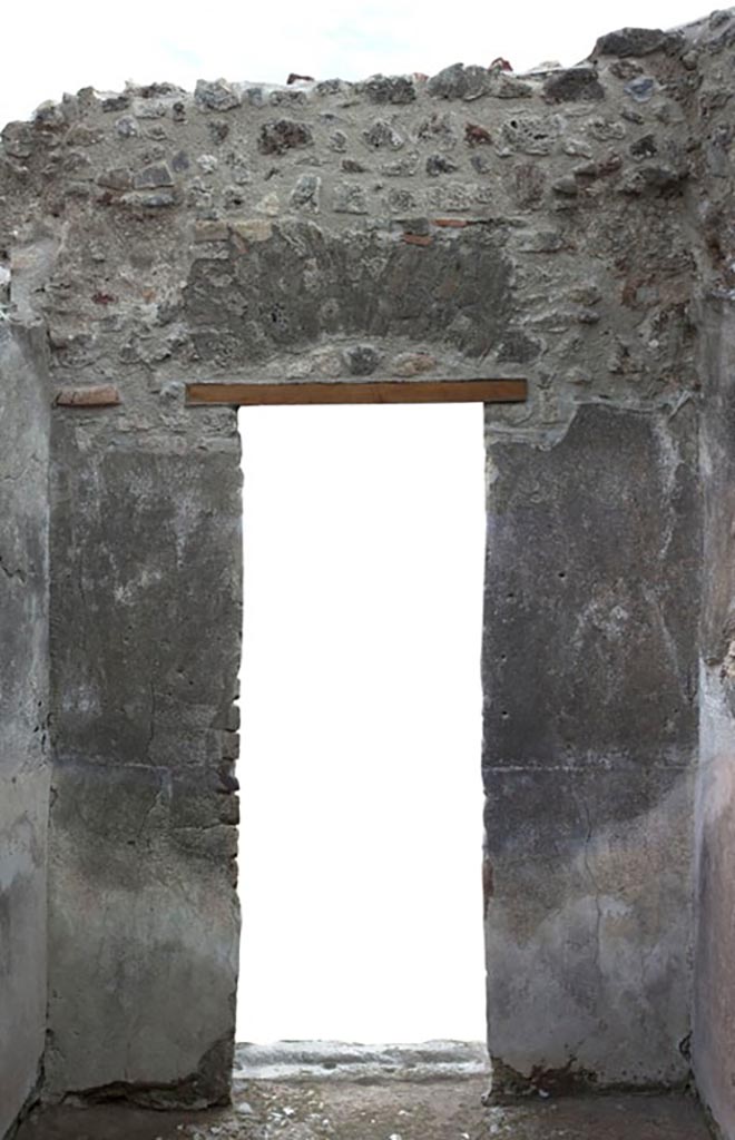 V.1.3 Pompeii. c.2012. 
Room 6, east wall with doorway to atrium, room 2.  
Photo by Hans Thorwid.
“E wall in 2012. Restored parts of the wall photographed and merge with the lower part and floor line of earlier photos from 2005-7.”
Photo and words courtesy of the Swedish Pompeii Project.
