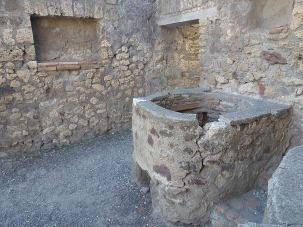 V.1.5 Pompeii. June 2012. Looking towards west wall and doorway into rear room. Photo courtesy of Michael Binns