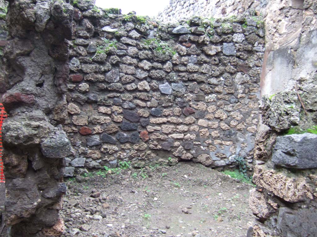 V.1.11 Pompeii. December 2005. 
Looking north through doorway towards north-west corner of room. This room was on the north side of the corridor.
