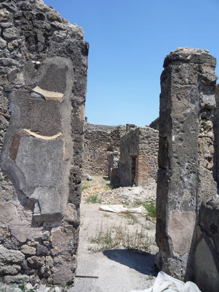 V.1.14 Pompeii. July 2008. Doorway in east wall leading into atrium of V.1.15. Photo courtesy of Jared Benton.
