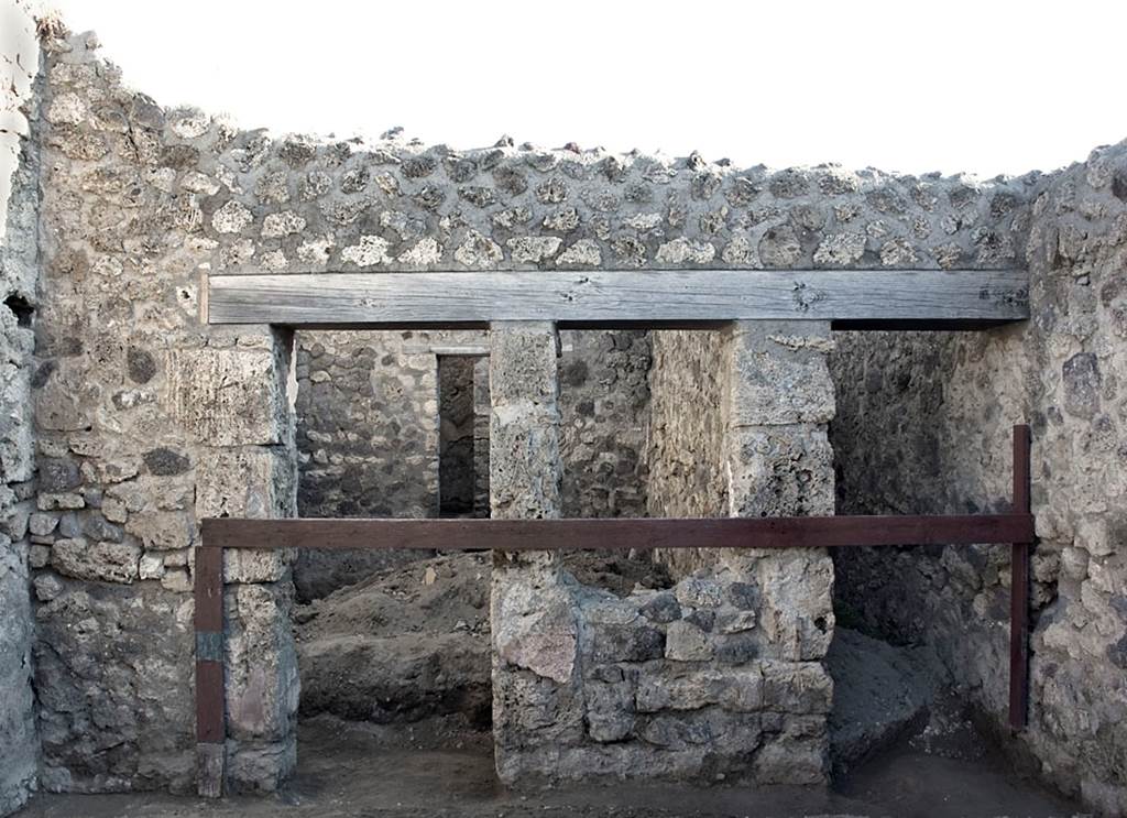 V.1.20 Pompeii. 2001. 
East wall of shop-room with doorway to rear room, on left, and to corridor, on right. Photo by Hans Thorwid.
Photo courtesy of The Swedish Pompeii Project.
