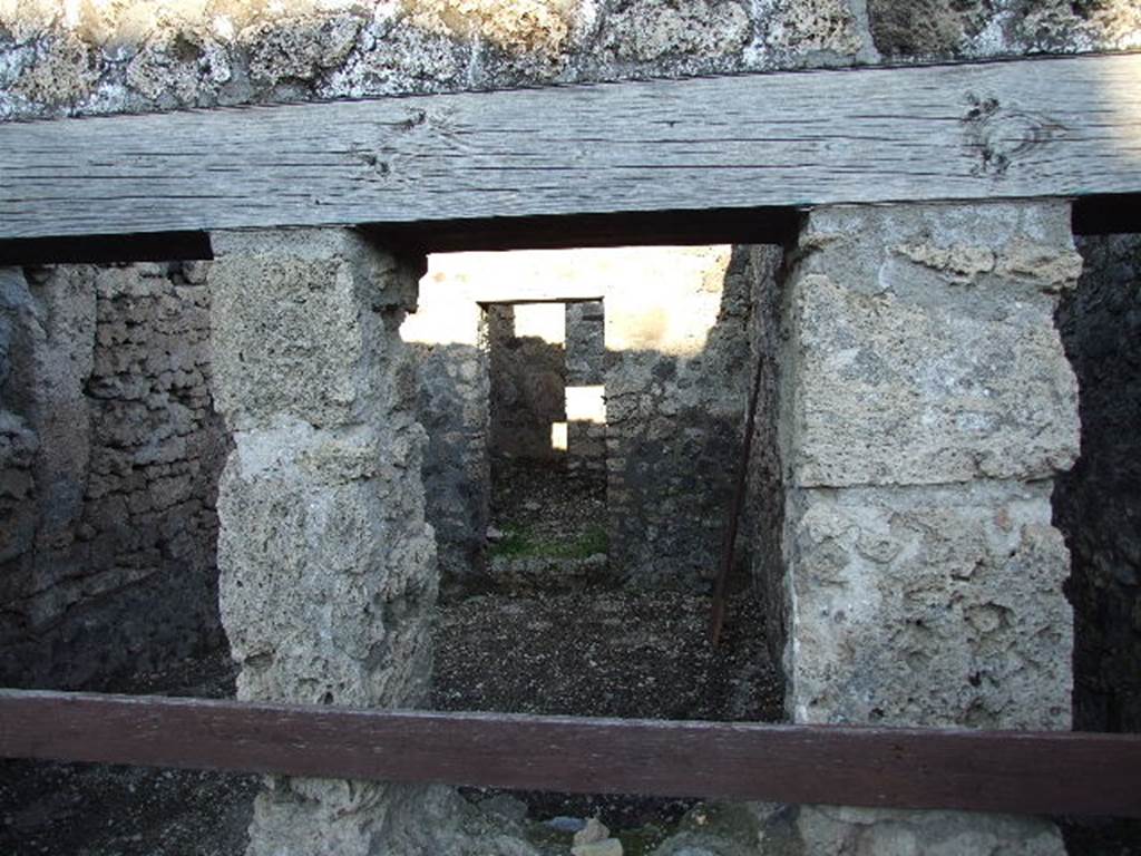 V.1.20 Pompeii. December 2006. Looking through window into rear room.