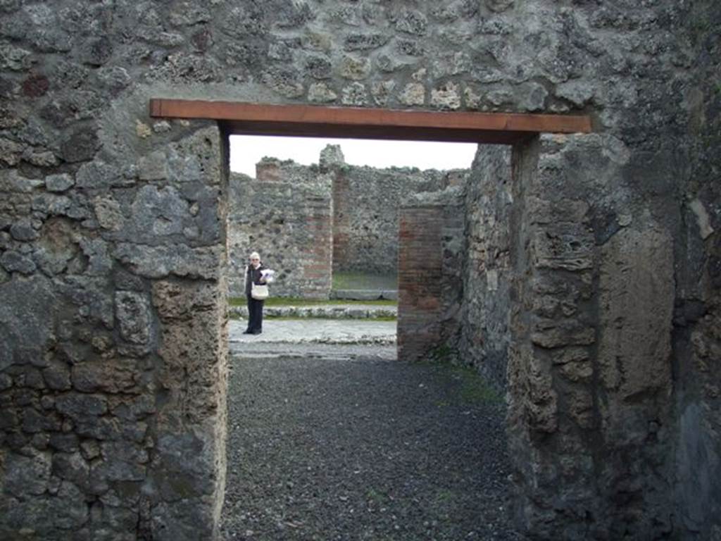 V.2.2 Pompeii. March 2009. Looking south from rear room “g”, towards front of shop “f” and Via di Nola.