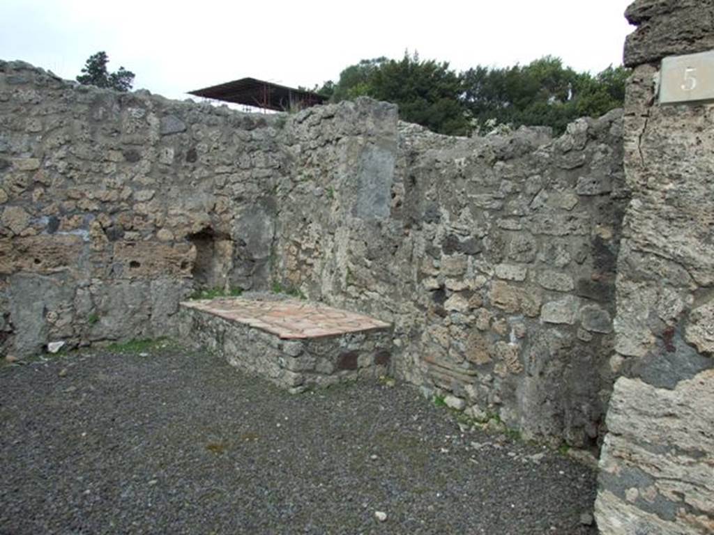 V.2.5 Pompeii.  March 2009.  East side of shop, with podium or hearth and window to V.2.6.