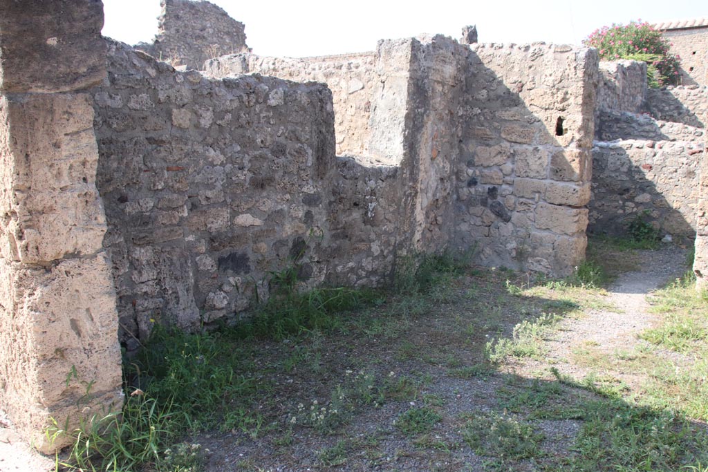 V.2.6 Pompeii. October 2023. Looking north along west wall of shop-room. Photo courtesy of Klaus Heese.