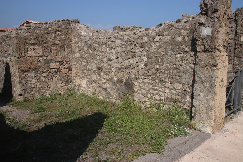 V.2.6 Pompeii. October 2023. Looking north along east wall of shop-room. Photo courtesy of Klaus Heese.