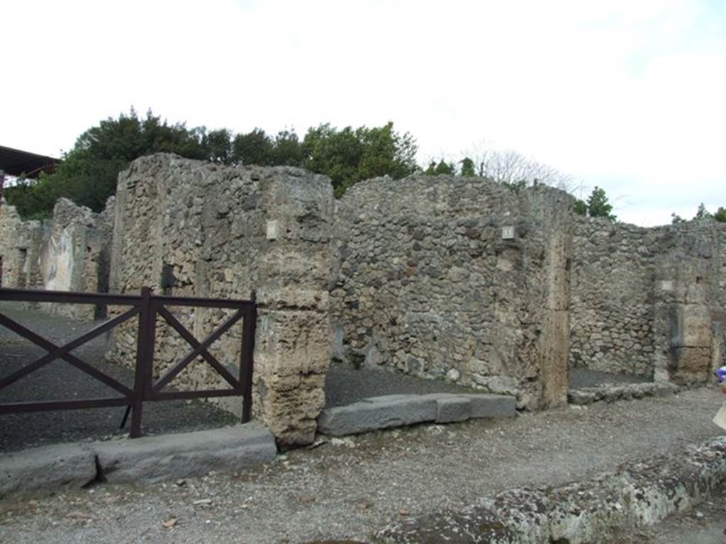 V.2.11 Pompeii. March 2009.  Doorways to V.2.10, V.2.11 (centre) and V.2.12, on Via di Nola.