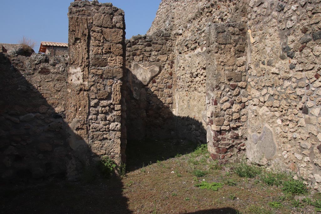 V.2.12 Pompeii. October 2023. Looking towards north side of shop-room with doorway to rear room. Photo courtesy of Klaus Heese.