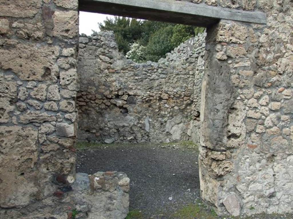 V.2.13 Pompeii. March 2009. Doorway to rear room.  According to Mau in BdI, when found this room was painted in the Fourth Style on a white background. It too had an upper room above it, the floor of which would have been at a height of 3.30m. See Mau, A., 1894. Mitteilungen des Kaiserlich Deutschen Archaeologischen Instituts, Roemische Abtheilung Volume VIII. (p.49)
