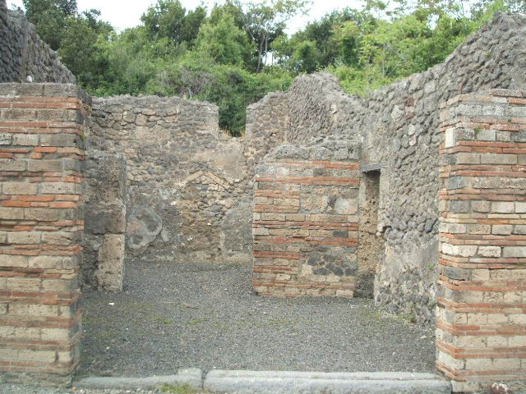 V.2.17 Pompeii. September 2005. Entrance, looking north.
On the west pilaster (left), between V.2.16 and 17, a graffito was found. According to Della Corte the possible owner of the thermopolium, shop and modest house (V.2.17-20) was named Pollia. 
See Della Corte, M., 1965.  Case ed Abitanti di Pompei. Napoli: Fausto Fiorentino. (p.130). According to Epigraphik-Datenbank Clauss/Slaby (See www.manfredclauss.de) the graffito read:

M(arcum) Cerrinium
aed(ilem) Pollia rog(at)   [CIL IV 368]
