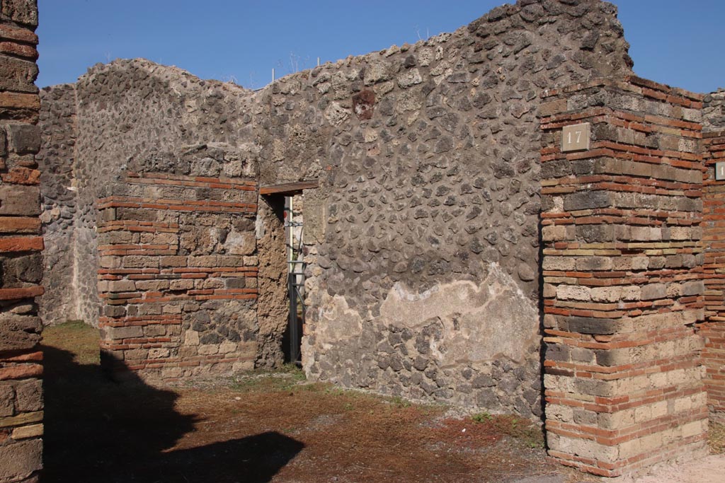 V.2.17 Pompeii. October 2022. Looking towards east wall of shop-room, with doorway into V.2.19. Photo courtesy of Klaus Heese.