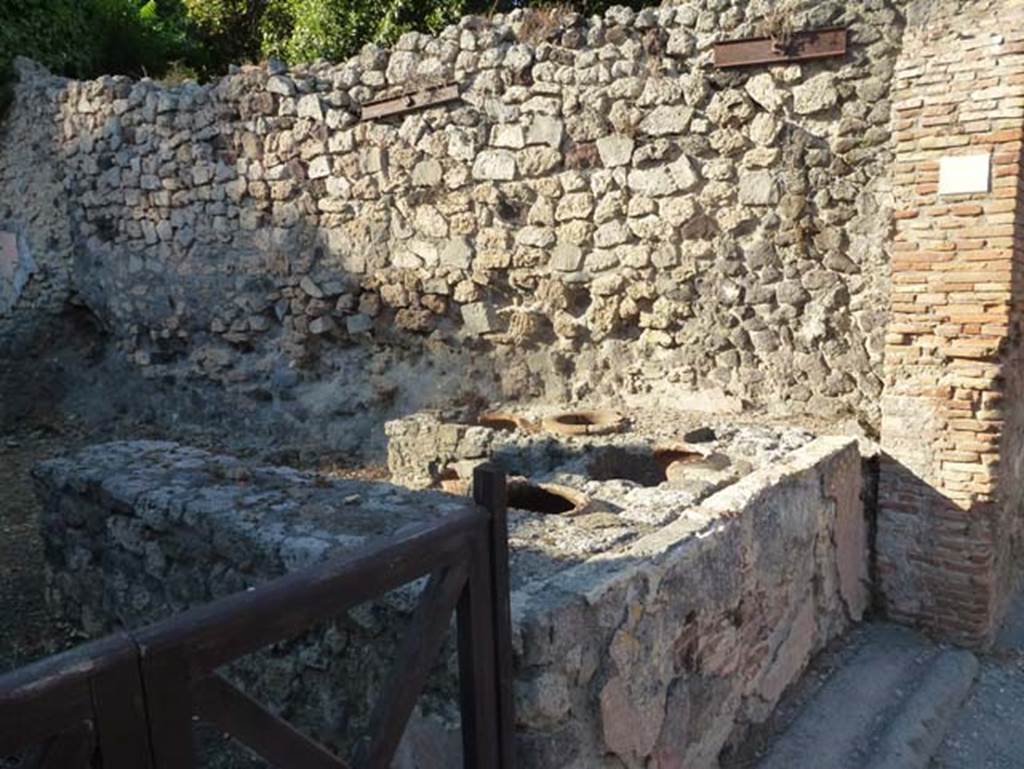 V.2.19 Pompeii. June 2012. Counter on east side of thermopolium. Photo courtesy of Michael Binns.