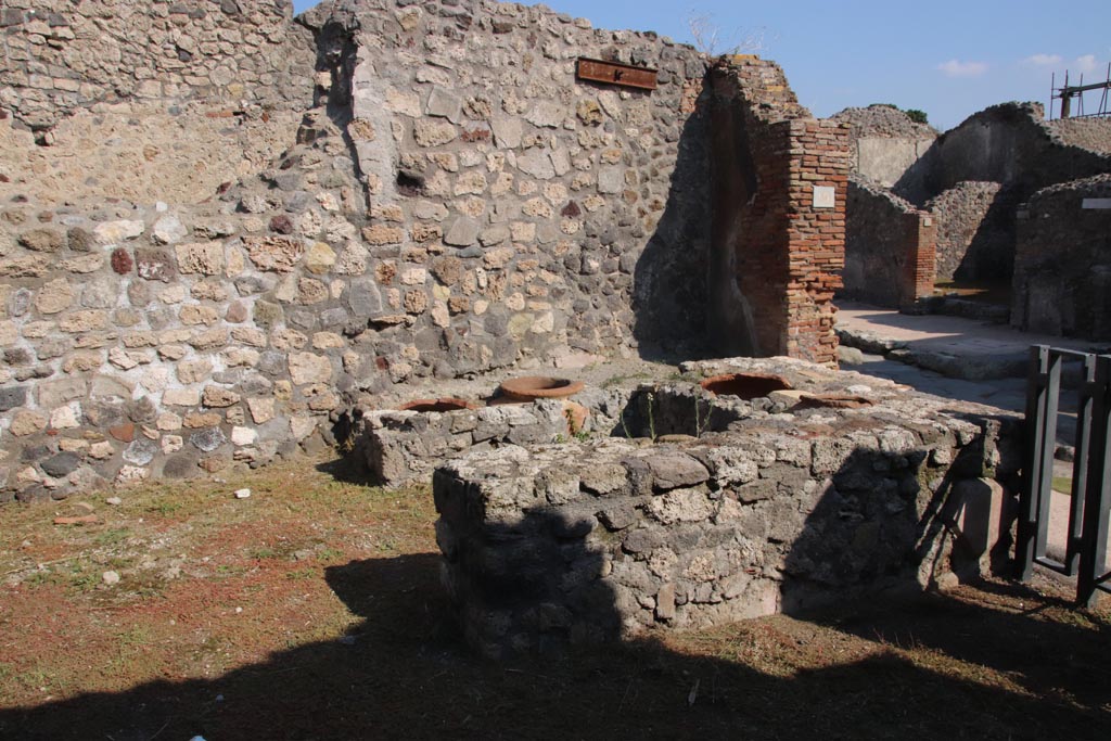 V.2.19 Pompeii. October 2022. Looking south-east across bar-room towards entrance onto Via di Nola. Photo courtesy of Klaus Heese.