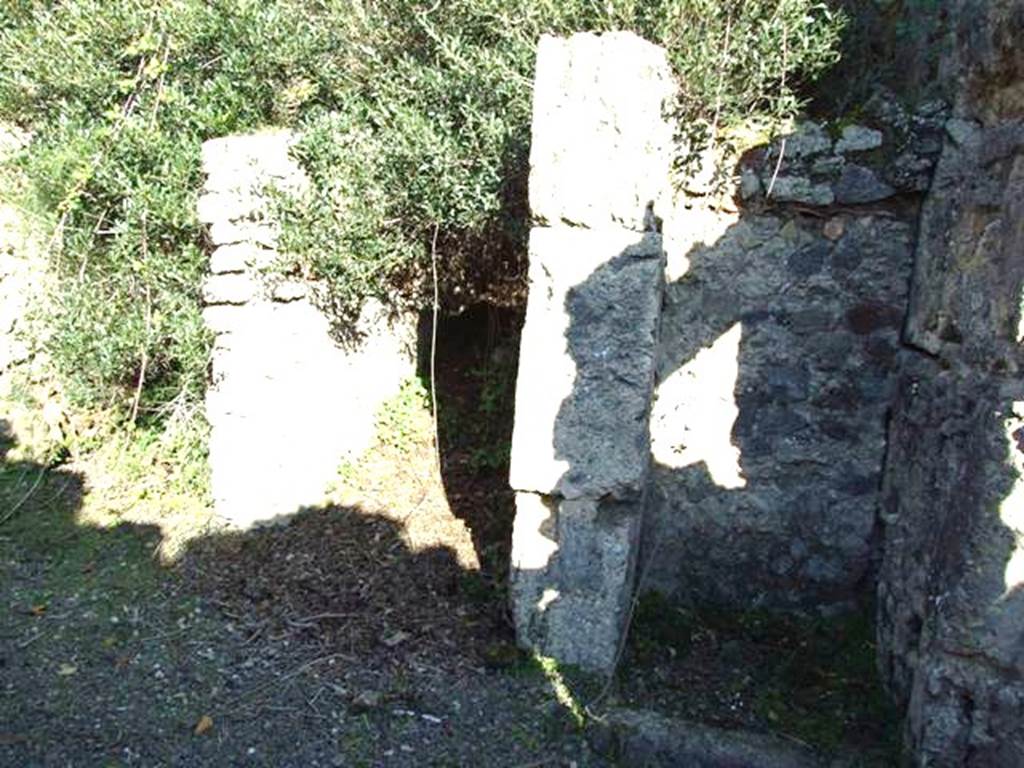 V.2.20 Pompeii. December 2007. Looking east across light-yard with entrance corridor from interior (centre), with latrine on right.