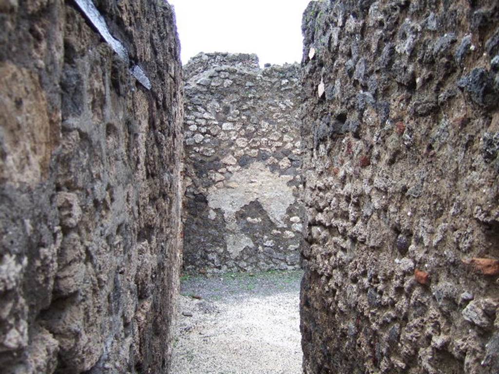 V.2.a Pompeii. December 2005. Looking east from entrance. On the left of the picture, the blocked door would have lead to the latrine.  This is now viewable in Room 4 of V.2.1
