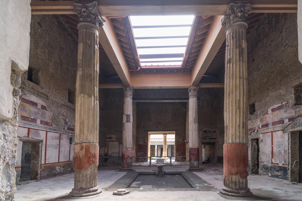 V.2.i Pompeii. March 2023. 
Room 1, atrium and impluvium looking south towards tablinum and peristyle. Photo courtesy of Johannes Eber.
