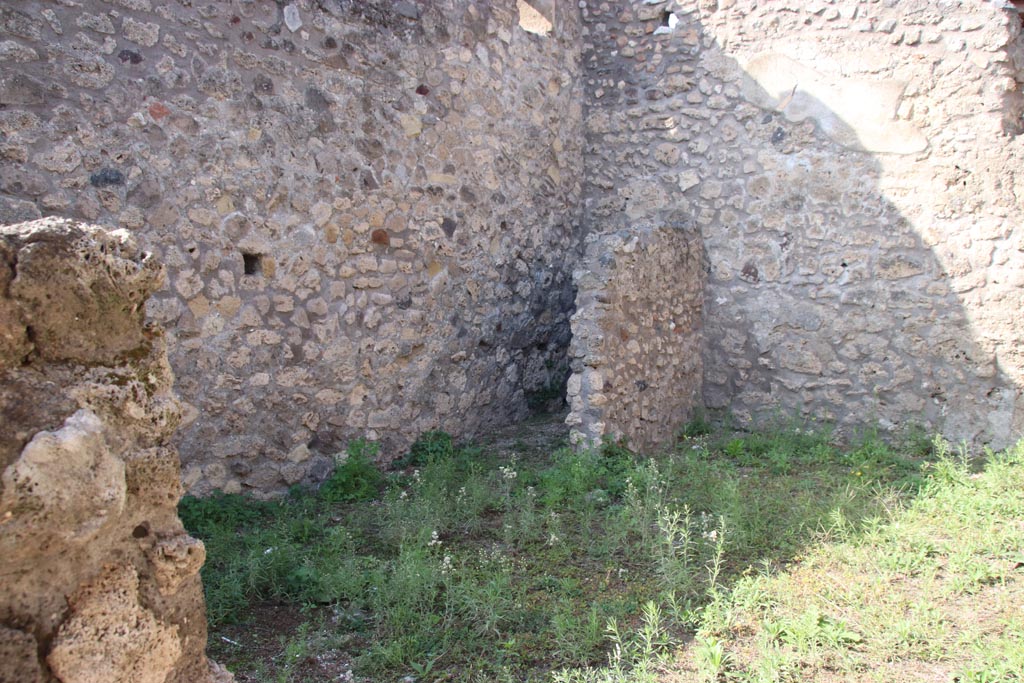 V.3.3 Pompeii. October 2023. Looking north-west across rear room towards latrine. Photo courtesy of Klaus Heese.