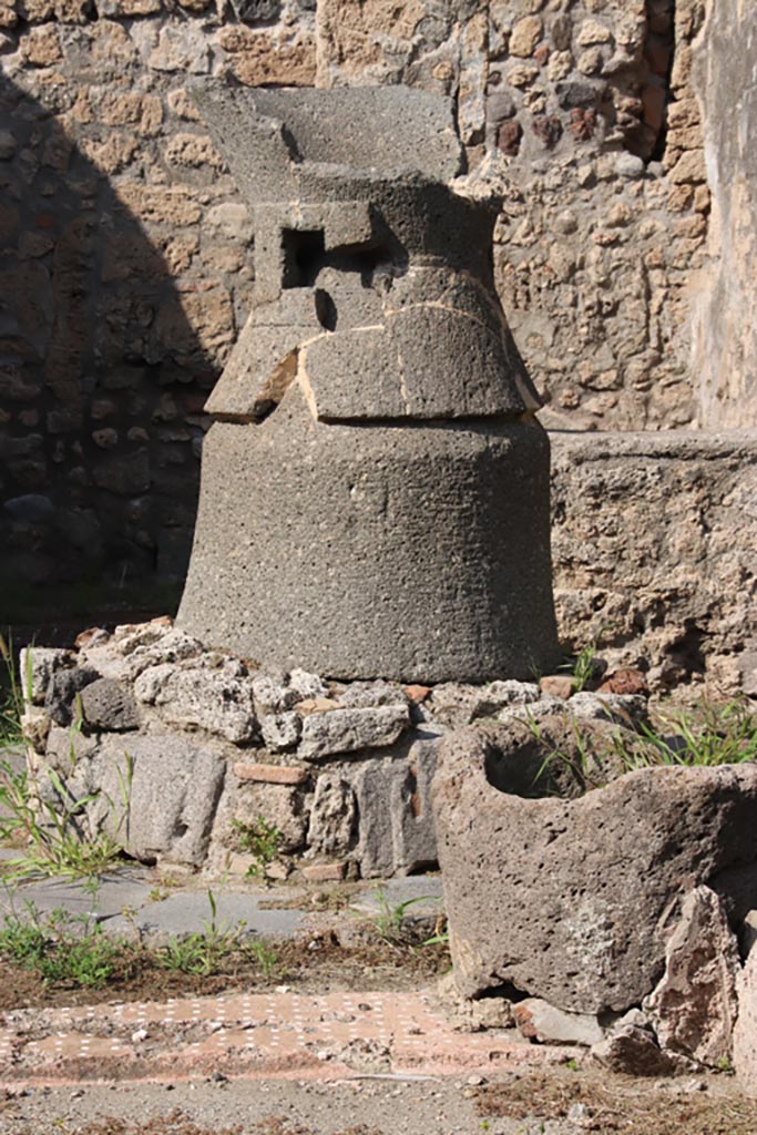 V.3.8 Pompeii. October 2023. 
North side of impluvium, remains of mill, and catillus and meta. Photo courtesy of Klaus Heese.
