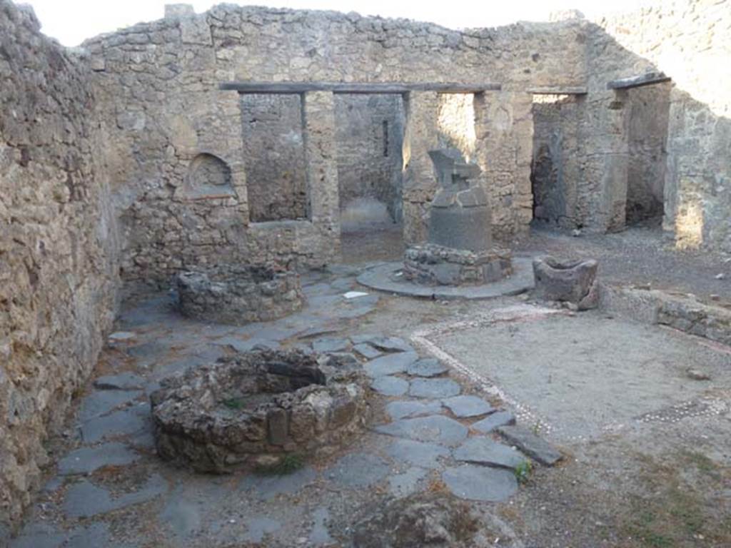 V.3.8 Pompeii. June 2012.  Looking north across west side of bakery atrium.  Photo courtesy of Michael Binns.
