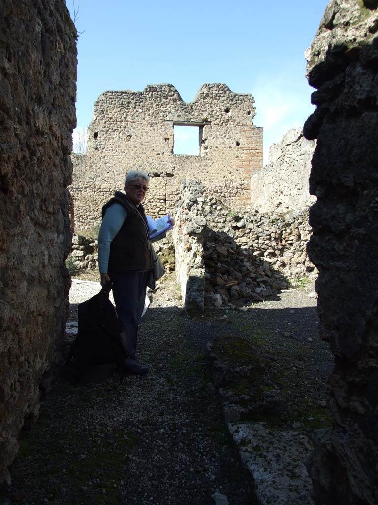 V.3.8 Pompeii. March 2009. Looking north along corridor with narrow room on the east side. 