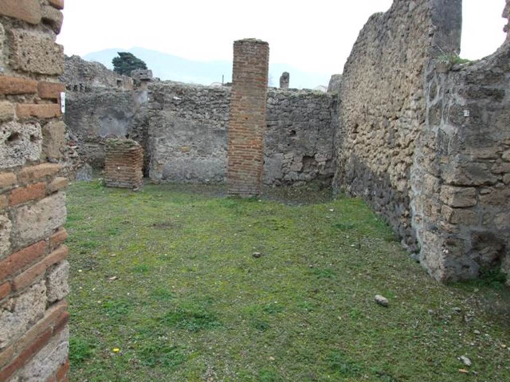 V.3.8 Pompeii.  December 2007.  Looking south east across area at rear on the north west side, taken from garden (b).  Jashemski identifies this as garden (a), which had a portico supported by two brick pillars.  See Jashemski, W. F., 1993. The Gardens of Pompeii, Volume II: Appendices. New York: Caratzas. (p.114).