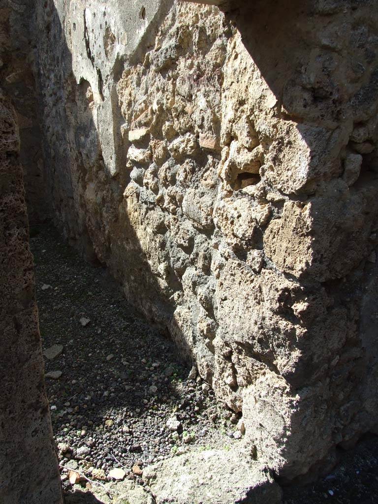 V.3.8 Pompeii. March 2009. Doorway and north wall of front room on west side of entrance corridor. 