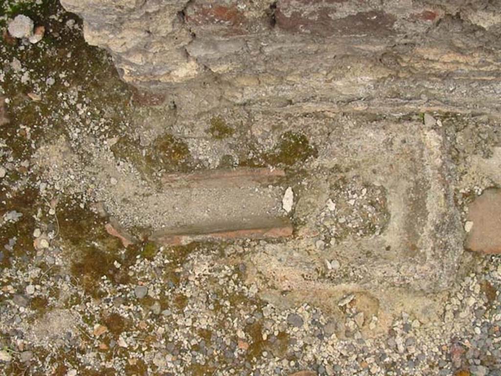 V.4.7 Pompeii. May 2003. Detail from side of stone bench or hearth. Photo courtesy of Nicolas Monteix.