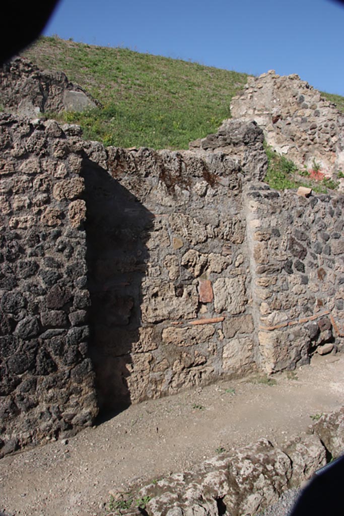 V.6 b, Pompeii. October 2023. Doorway on north side of Via delle Nozze d'Argento. Photo courtesy of Klaus Heese.