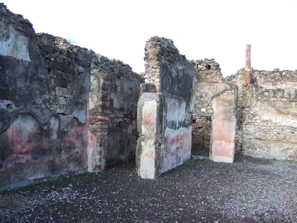 VI.5.16 Pompeii. December 2005. Doorways to rooms in north-west corner of atrium.