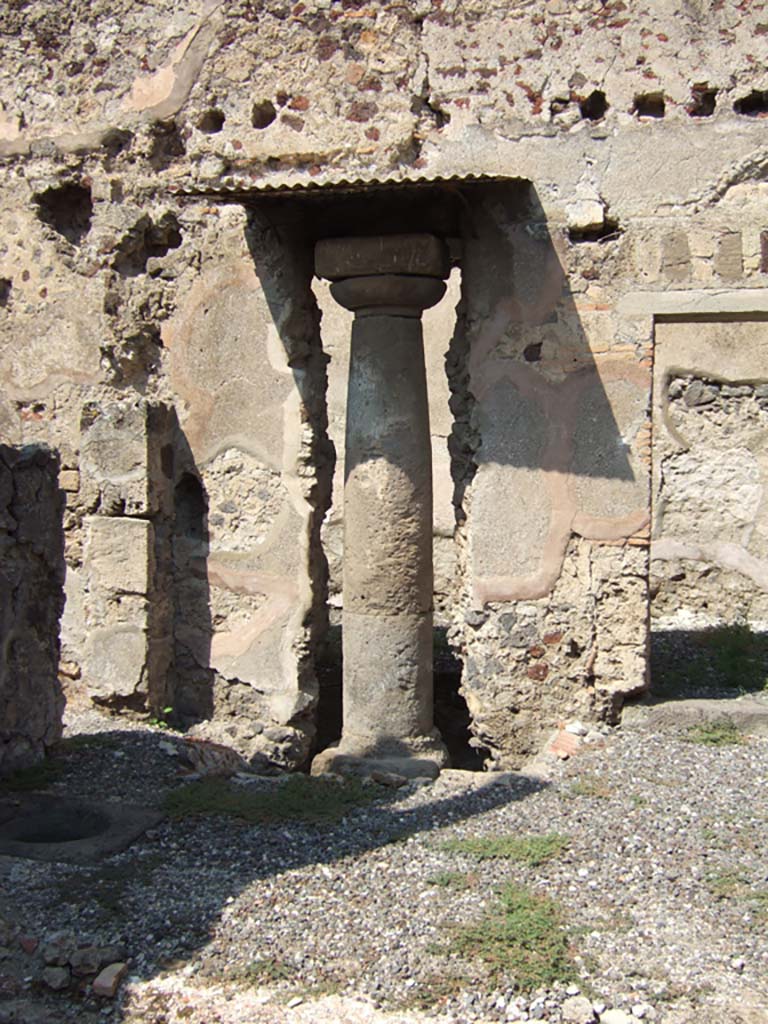 VI.5.17 Pompeii. September 2005. Ancient column built into the north wall of the atrium area.
