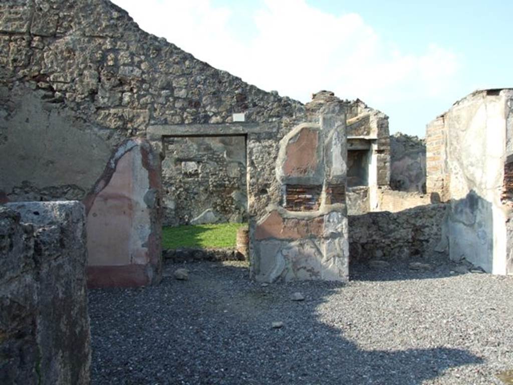 VI.7.6 Pompeii. March 2009. Room 1, atrium, looking north to doorway to south portico of the garden area, at the side of the small tablinum. Through the window in the rear wall of the tablinum, can be seen the site of the wide window of the triclinium. According to Jashemski, the tablinum and the triclinium had a wide window looking out onto the garden area. See Jashemski, W. F., 1993. The Gardens of Pompeii, Volume II: Appendices. New York: Caratzas. (p.129)
