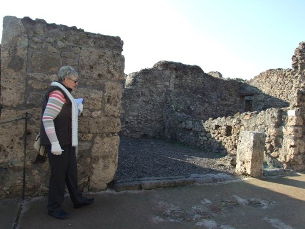 VI.7.13 and VI.7.14 Pompeii. December 2007. Looking west to doorways in Via di Mercurio.
According to Boyce –
“Taberna.  On one wall there is a painting of two serpents confronted at an altar furnished with offerings”.
He quotes references – Sogliano, 50; Fiorelli, Descrizione, 110; Niccolini, ii, Desc. Gen., 31.
See Boyce G. K., 1937. Corpus of the Lararia of Pompeii. Rome: MAAR 14, (p.48, no.164).
See Sogliano, A., 1879. Le pitture murali campane scoverte negli anni 1867-79. Napoli: (p.17, no.50, “nearly destroyed”) 
According to Fiorelli - on one of the walls of this shop there was a painted lararium.
Nothing appears to remain now.
Fiorelli reported that only the serpents at the sides of the altar remained.
See Pappalardo, U., 2001. La Descrizione di Pompei per Giuseppe Fiorelli (1875). Napoli: Massa Editore. (p.58)

