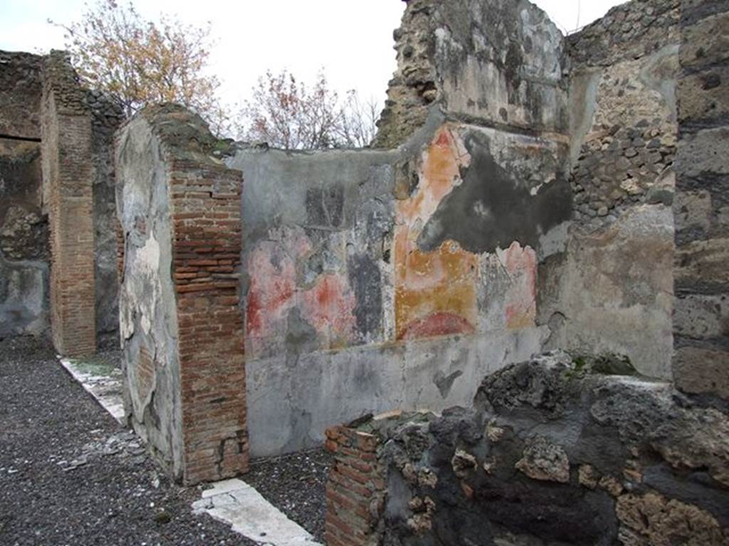 VI.7.20 Pompeii. December 2006. Looking west along north portico of peristyle towards doorway to triclinium, on left, and west wall and doorway to small oecus.

