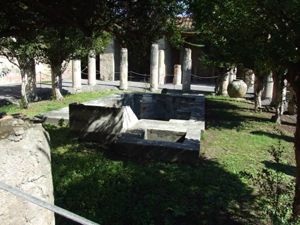 VI.9.2 Pompeii. March 2009. Peristyle garden 17, looking east.  According to Jashemski, the large dolium 23  in the south-east corner of the garden contained lime. This would have been used in the restoration work going on at the time of the eruption. Tatiana Warscher believed that it had originally been used as a planter. See Jashemski, W. F., 1993. The Gardens of Pompeii, Volume II: Appendices. New York: Caratzas. (p.137-8).  See Warscher, “Codex”, appendix to House of Pansa, photo no.46a.
